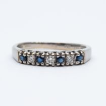 An 18ct white gold sapphire and diamond eternity ring