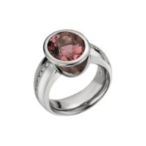 An 18ct white gold oval pink spinel and diamond set dress ring