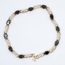 A 9ct yellow gold sapphire and diamond bracelet