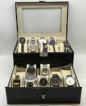 A black leather stitched case with watches and bracelets