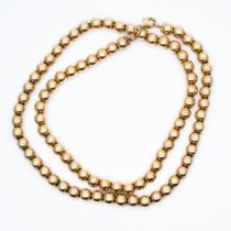 A 9ct yellow gold pearl ball necklace
