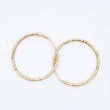 A pair of 9ct yellow gold diamond cut hoop earrings