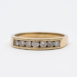 A 9ct yellow gold diamond channel set eternity ring