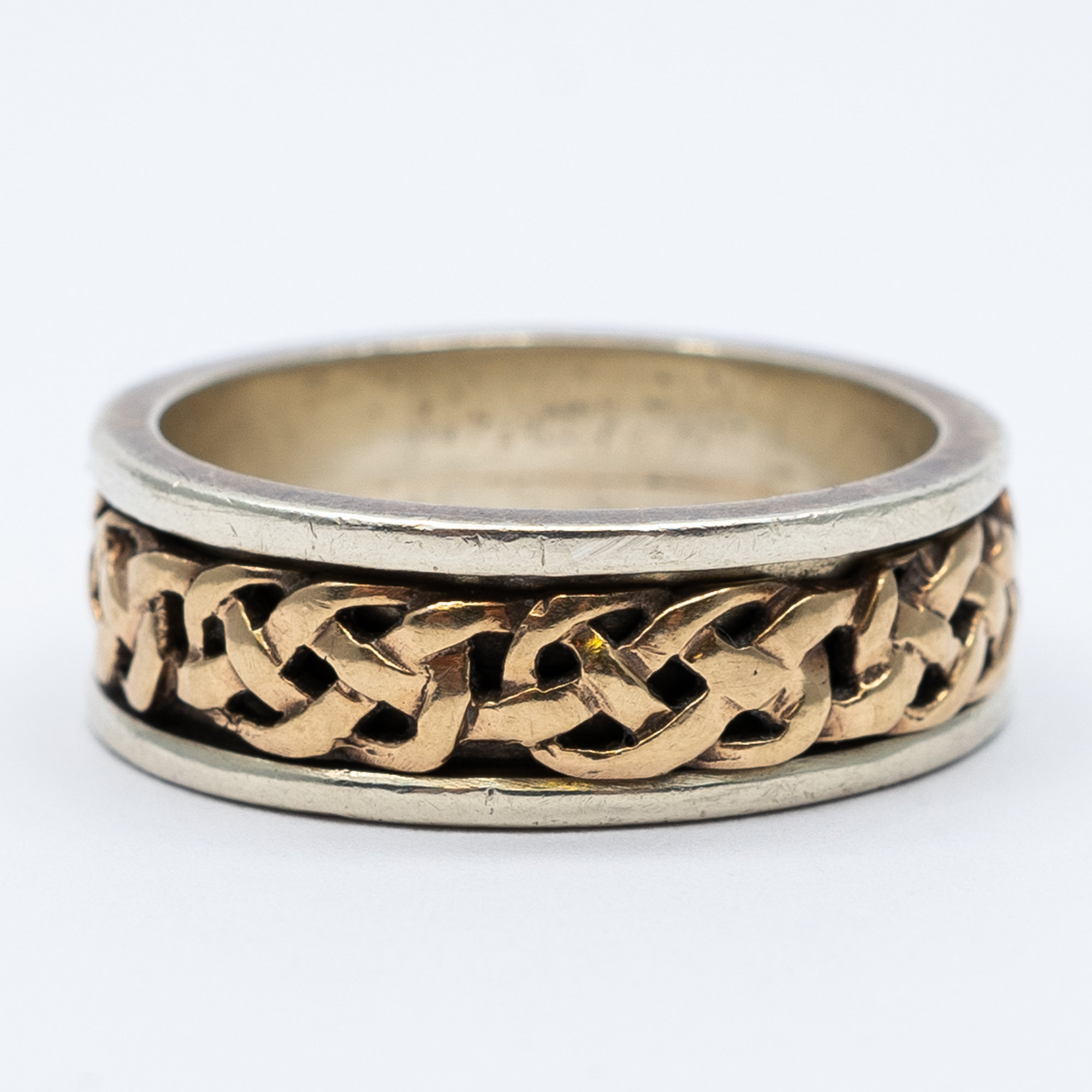 A 9ct rose and white gold celtic band - Image 2 of 4