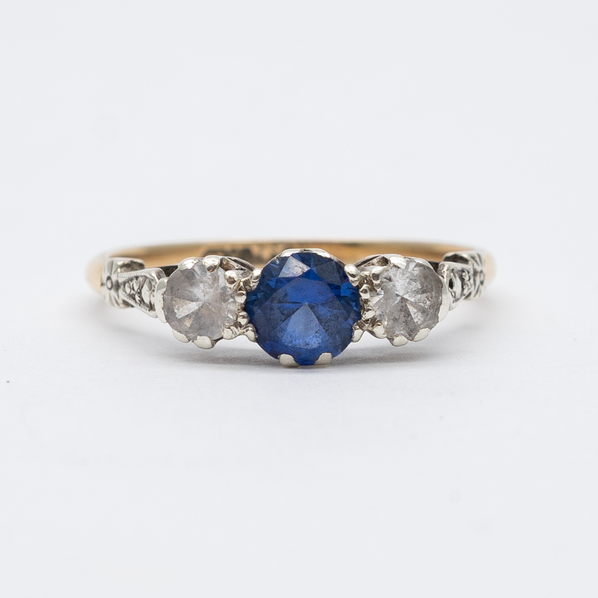 A 9ct yellow gold cz blue stone ring