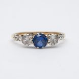 A 9ct yellow gold cz blue stone ring
