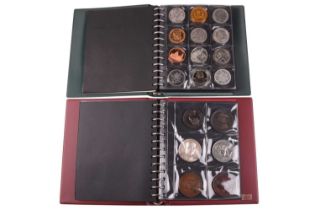 A varied collection of coins, medals and tokens, contained in two albums, to include two Edward I