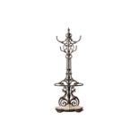 A Victorian Coalbrookdale cast iron hallstand with hat and coat hooks above a stick stand with