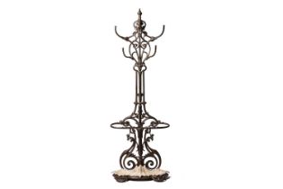 A Victorian Coalbrookdale cast iron hallstand with hat and coat hooks above a stick stand with