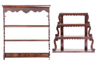 An 18th-century stained wood graduated three-tier Delft rack, supported on the sides by s-shaped