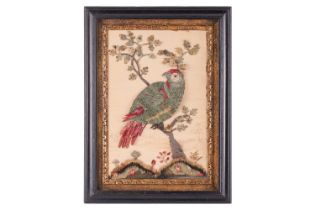 A late George III cut and applied silk picture depicting a parrot on an oak tree branch, 35 x 23,