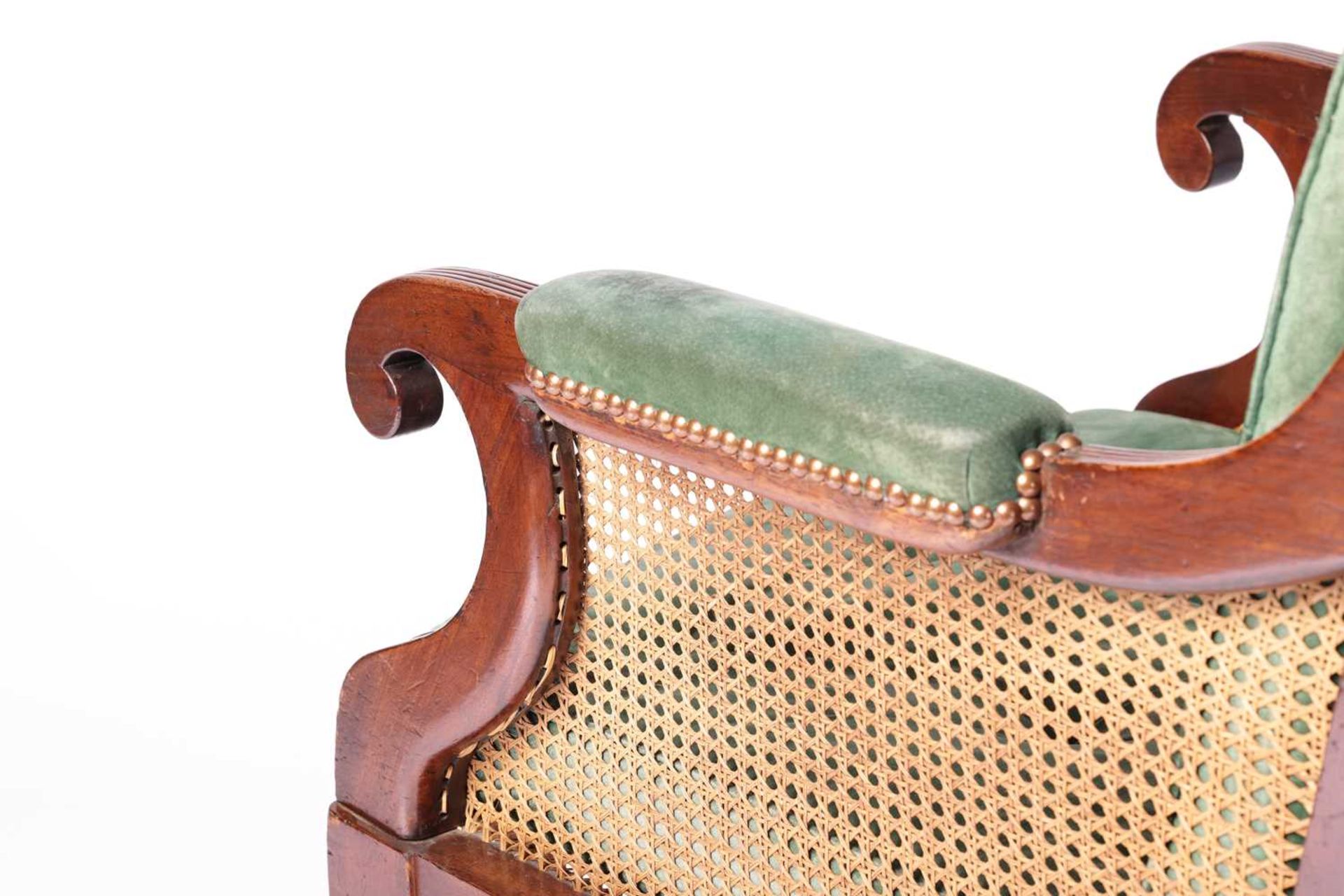 A George IV mahogany frame bergere library chair in the manner of Holland & Co, with cane back and - Image 5 of 7