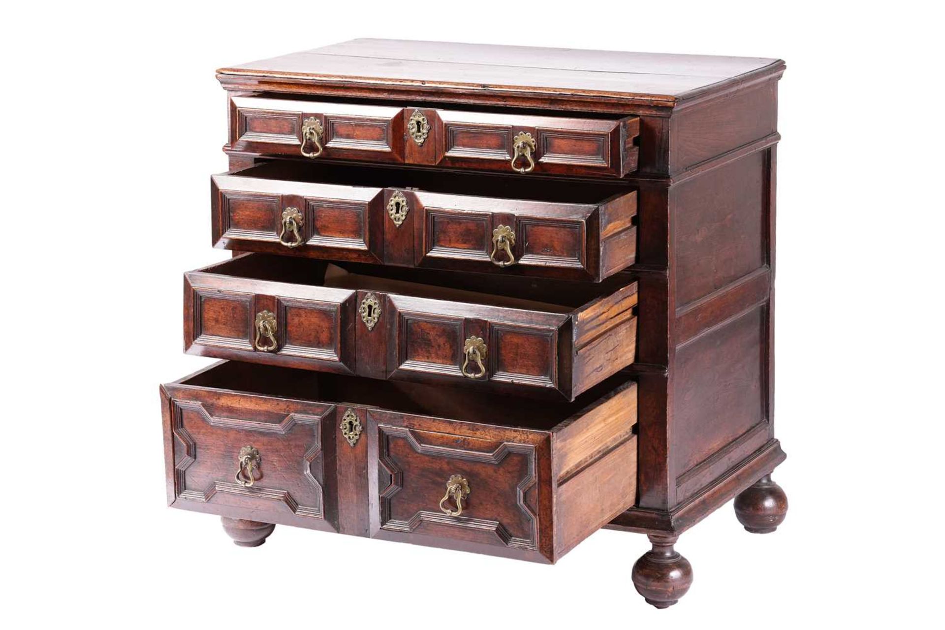 A late 17th-century walnut chest of four long drawers with raised geometric moulded fronts and - Image 3 of 10