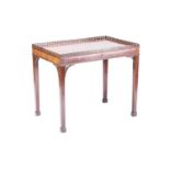 A George III mahogany rectangular silver table with a pierced gallery top and corner brackets, on