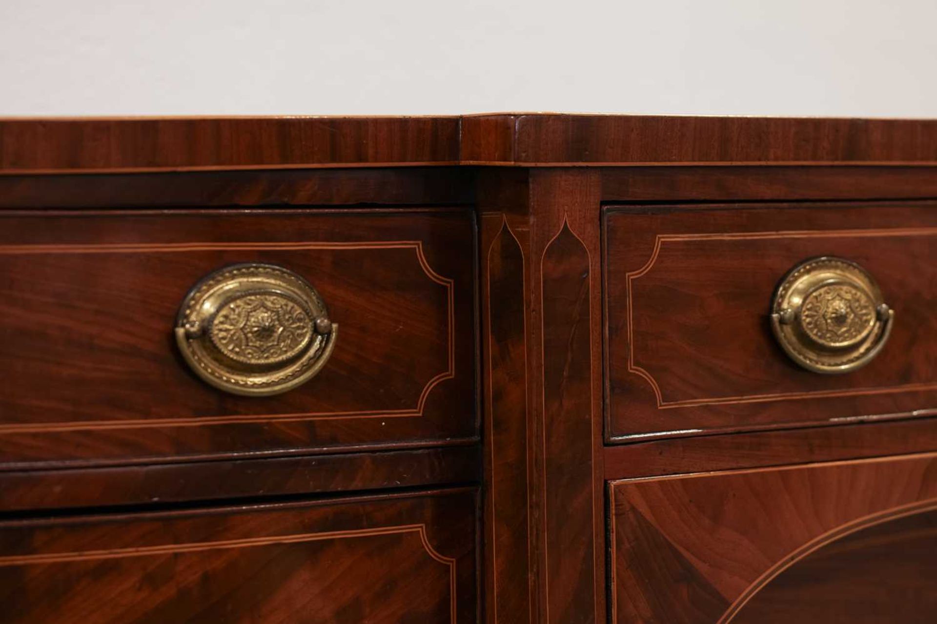 A George III inlaid mahogany stepped bowfront kneehole sideboard, with cross banded top, over two - Image 3 of 3