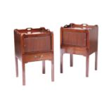 A pair of George III style mahogany tray-topped pot cupboards tambour fronted and sliding lower