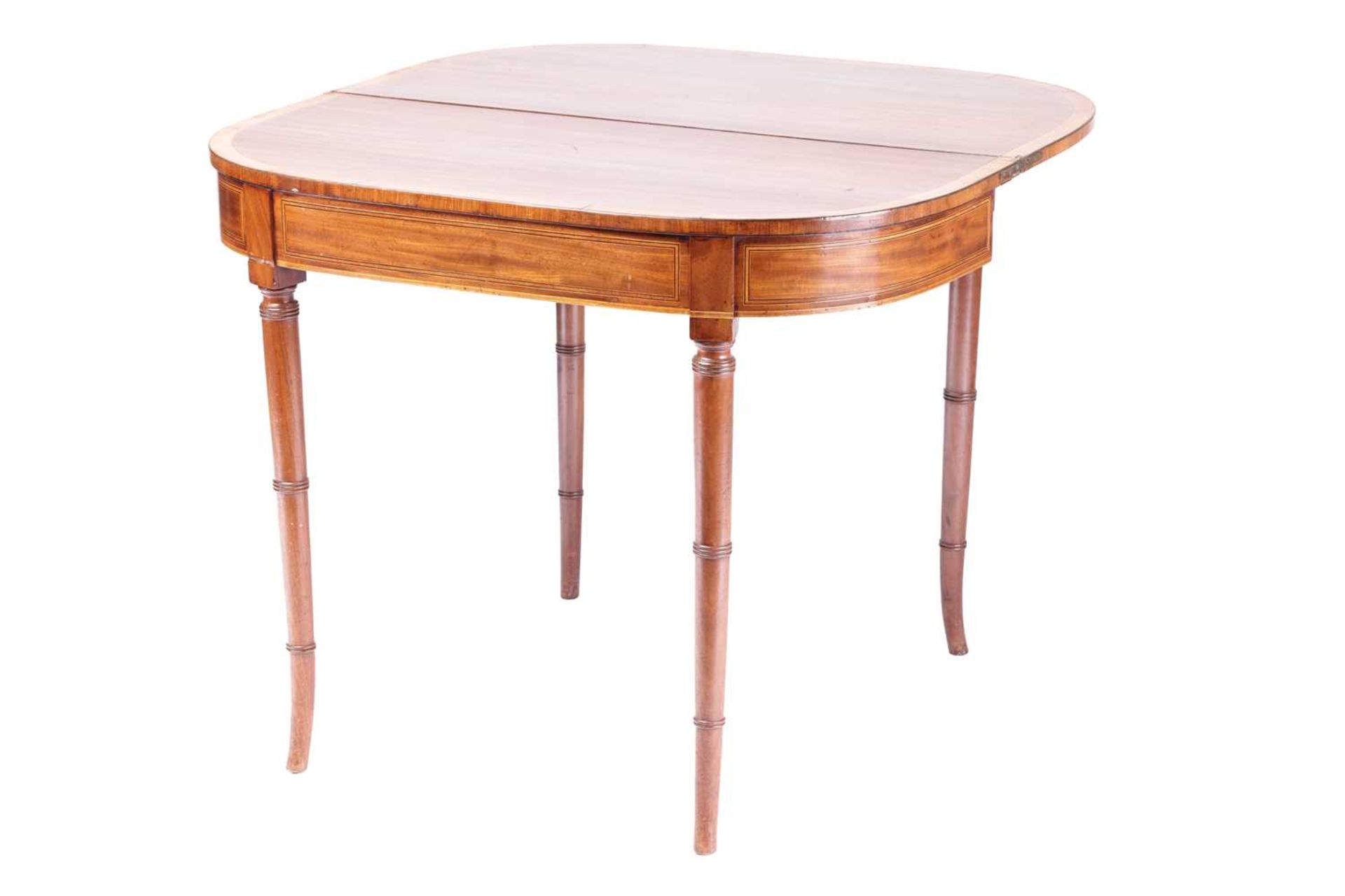 A George III bow-fronted mahogany fold-over tea table, with satinwood crossbanding supported on - Image 5 of 7