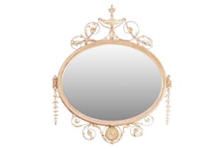 An Edwardian carved and gilt gesso oval overmantel mirror with urn surmount and swag decoration. 109