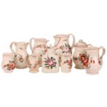 Nine pieces of late eighteenth-century/early nineteenth-century creamware jugs, florally
