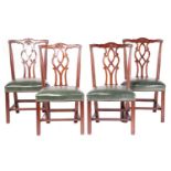 Four George III-style mahogany dining chairs, twentieth century above stuff over close nailed hide