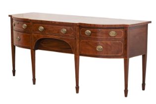 A George III inlaid mahogany stepped bowfront kneehole sideboard, with cross banded top, over two