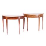 Two similar George III mahogany demi tables one a gaming table with crossbanded top and lined in