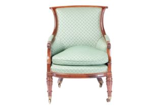 A William IV mahogany framed scroll back upholstered library chair, with moulded outline and stuff