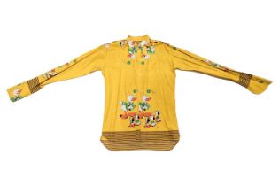 A 1960s beagle-collared yellow shirt, from the collection of Vivian Stanshall, founding member of