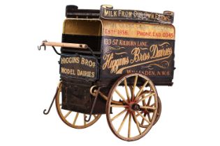 An early 20th century (circa 1915-20) hand-pulled three-wheel milk cart, a barn find, with painted