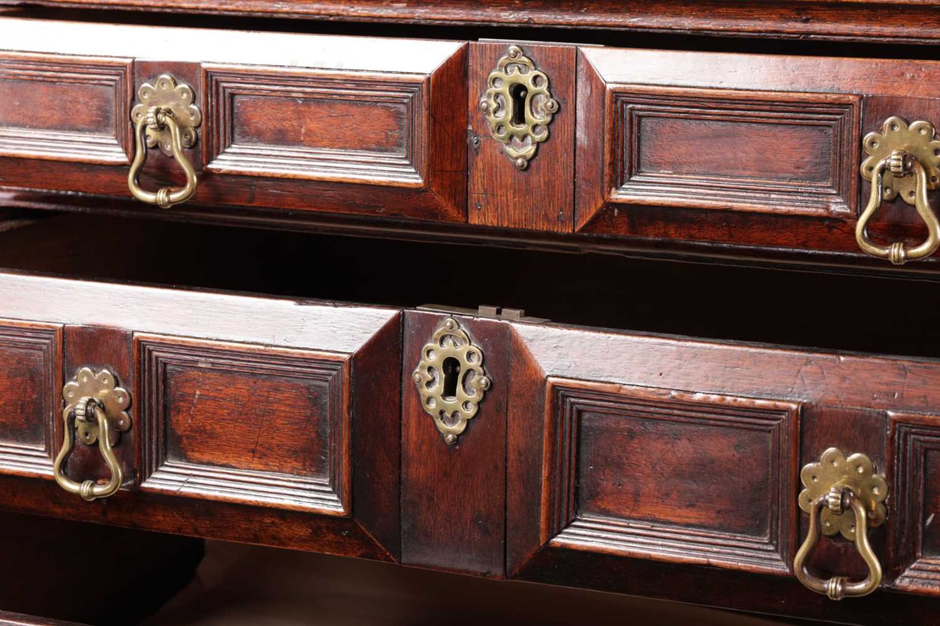 A late 17th-century walnut chest of four long drawers with raised geometric moulded fronts and - Image 5 of 10