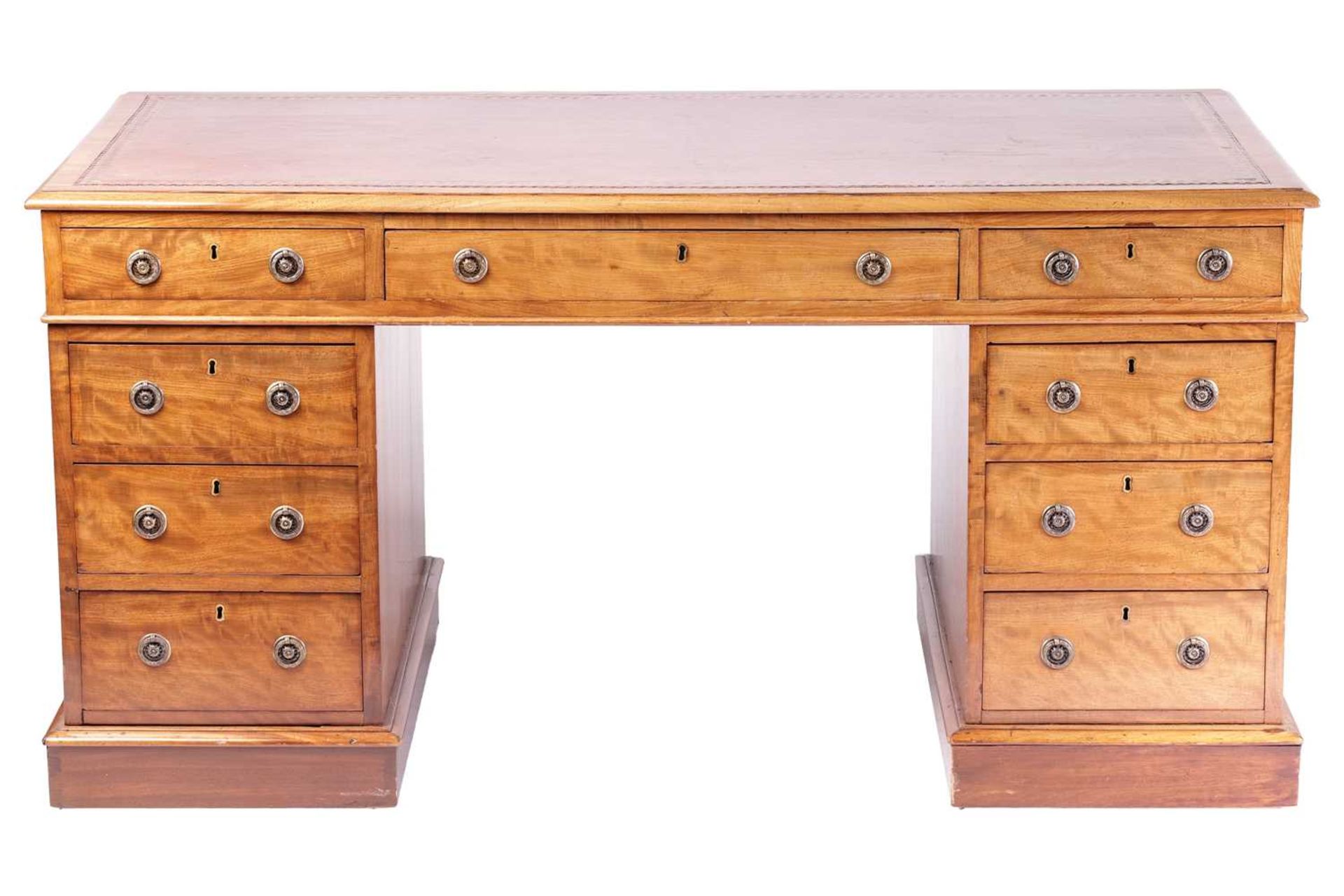 A Victorian mahogany twin pedestal kneehole desk with tooled leather inset and crossbanded border,