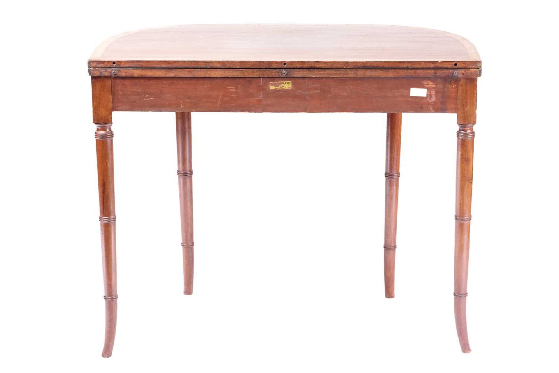 A George III bow-fronted mahogany fold-over tea table, with satinwood crossbanding supported on - Image 3 of 7