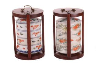 A near pair of Japanese Kakiemon porcelain food carriers, (Jubako) c.1800, comprising four stacked