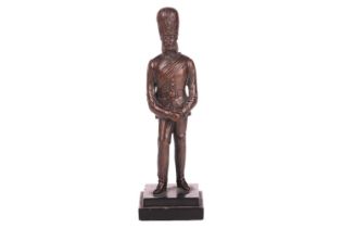 Late 19th-century school, a bronze figure of a Grenadier guard, on a two-tiered square base, 18 cm x