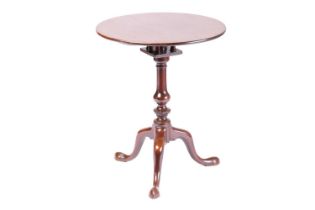 A small well-drawn George III mahogany circular snap-top wine table, with a birdcage block above a