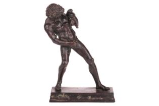 19th-century school, a patinated bronze figure of a Satyr with a Wineskin, on a rectangular base, 23