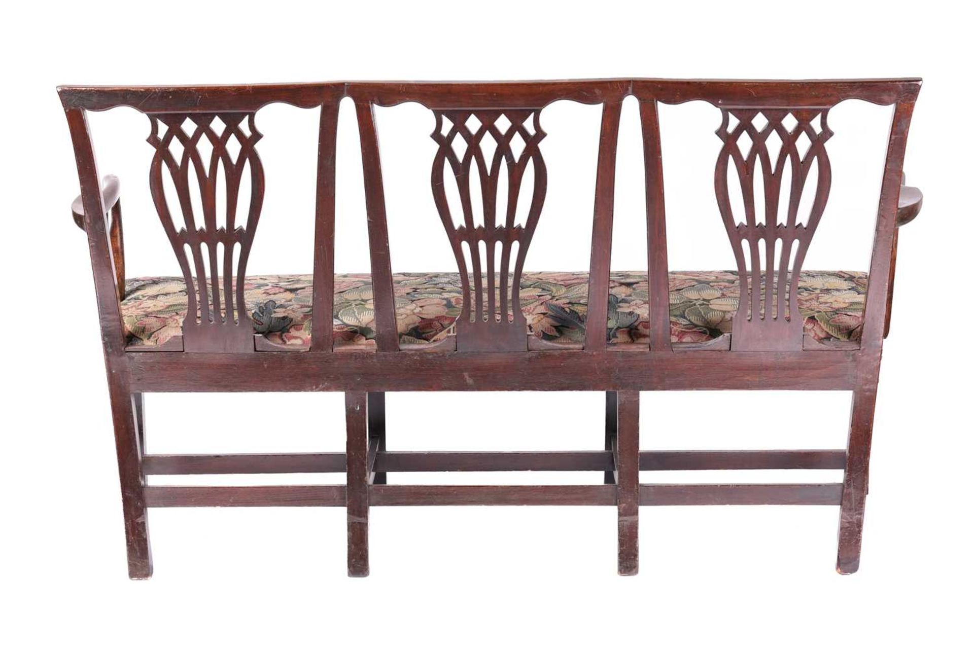 A George III mahogany triple chair back hall seat, with angular backs above three bullrush and - Image 4 of 5