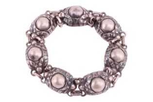 Georg Jensen - a foliate link bracelet, domed centre flanked by repoussé berries and foliate motifs,