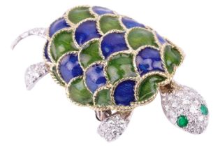 A diamond and enamel tortoise brooch with emerald eyes, the head and tail articulated to provide