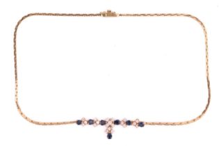 A sapphire and diamond necklace in 18ct yellow gold, set with pear-shaped blue sapphires