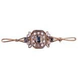 A sapphire and rose cut diamond cluster bar brooch, the central sapphire measuring 6 x 4.2mm,