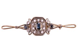 A sapphire and rose cut diamond cluster bar brooch, the central sapphire measuring 6 x 4.2mm,