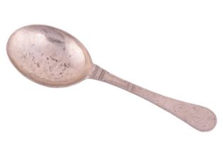 An 18th Century Scandinavian spoon, a flat handle engraved with a landscape motif with florals and a