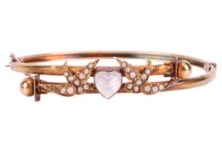 A moonstone and seed pearl swallow bangle, set with a heart-shaped moonstone to the centre between