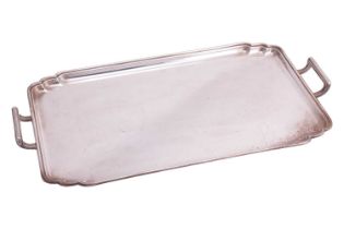 A two-handled tea tray; rounded rectangular with a moulded border and raised, angled side handles.
