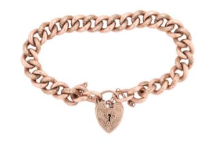 A 9-carat rose gold curb pattern bracelet with a later padlock clasp. Engraved and polished links,