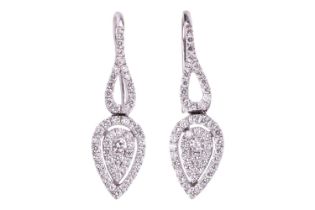 A pair of diamond set drop earrings. The leaf design earrings are set with 0.69cts of pavé set