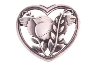 Georg Jensen - a heart-shaped brooch depicting a flying dove with olive branches, fitted with a