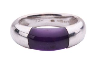 An amethyst dress ring in 18ct white gold, the polished amethyst set in a closed-back integrated D-