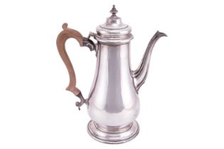 A George II style coffee pot; of low bellied baluster form, with fluted spout and raised cover